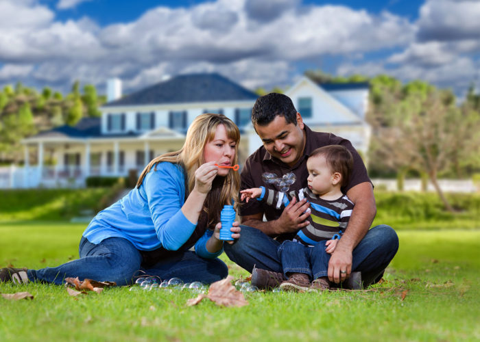 family sitting on lawn